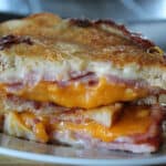air fryer grilled ham and cheese sliced in half and stacked