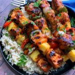 plate of hawaiian chicken kabobs and rice