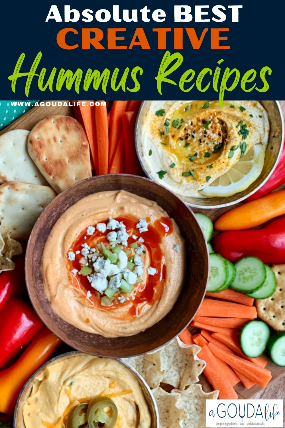 what to eat with hummus overhead view of 3 hummus varities and fresh vegetables