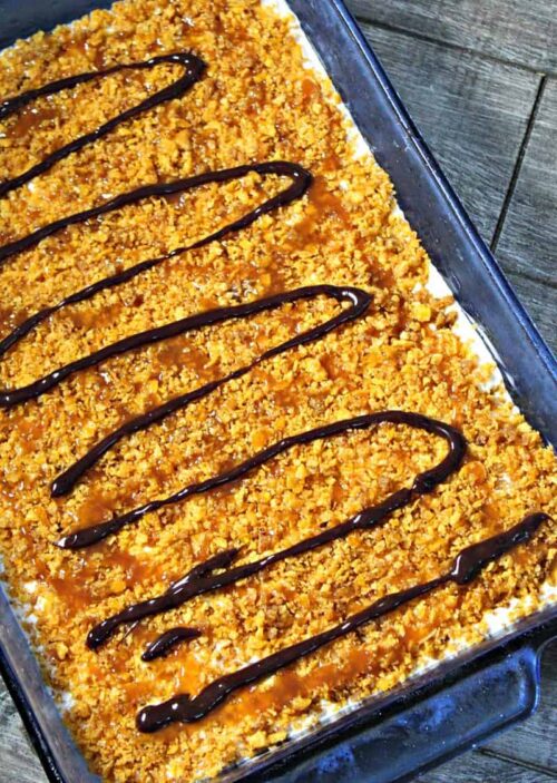 Easy Fried Ice Cream Cake ~ vanilla ice cream with a crispy honey-cinnamon coating drizzled with fudge and topped with whipped cream and fresh strawberries.