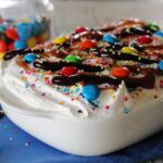 white casserole dish with the best labor day dessert, ice cream sandwich cake