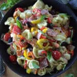 overhead view black bowl with zesty italian pasta salad with tortellini