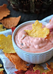bowl of dip surrounded by tortilla chips