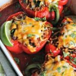 Mexican Stuffed Peppers baked in white casserole dish