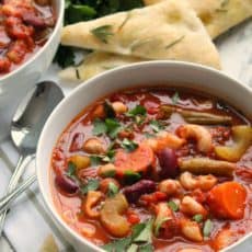 best sides with minestrone soup - bowl of minestrone soup with focaccia bread
