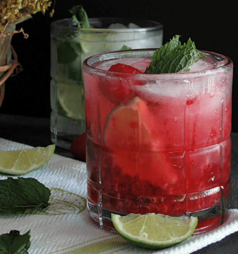 side view of raspberry and classic mojitos garnished with mint