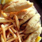 white plate with fried perch and french fries