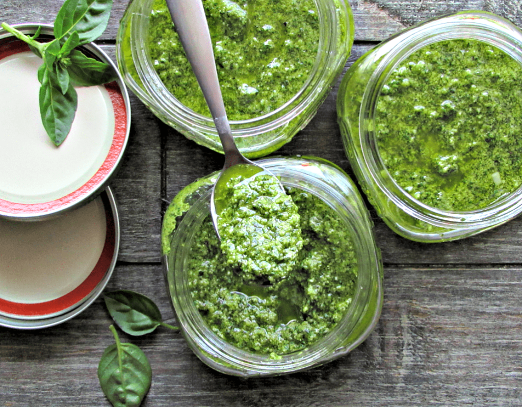 overhead view of pesto in a mason jar. what's the difference between pesto and chimichurri?