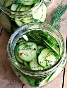 overhead view refrigerator dill pickles in glass jar