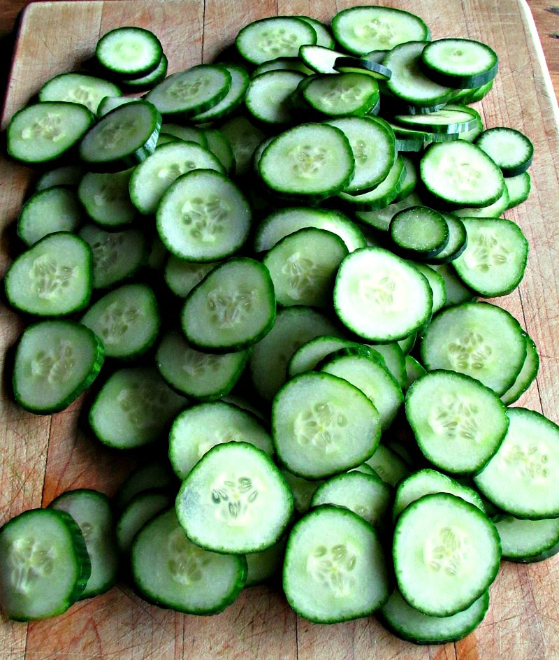 easy refrigerator dill pickles recipe ~ sliced cucumbers on cutting board