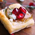 Pear Blue Cheese Puff Pastry Bites ~ golden puff pastry + maple bacon onion jam, caramelized pears and blue cheese. A simple, elegant holiday appetizer.