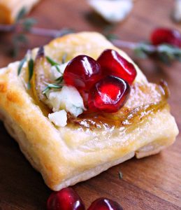 Pear Blue Cheese Puff Pastry Bites ~ golden puff pastry + maple bacon onion jam, caramelized pears and blue cheese. A simple, elegant holiday appetizer.