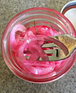pickled red onions ~ overhead shot of onions in mason jar