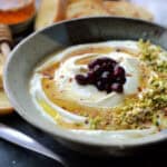 bowl with whipped ricotta dip drizzled with hot honey.