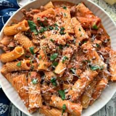 overhead view of sausage rigatoni garnished with parsley