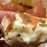 crusty bread topped with melted saganaki