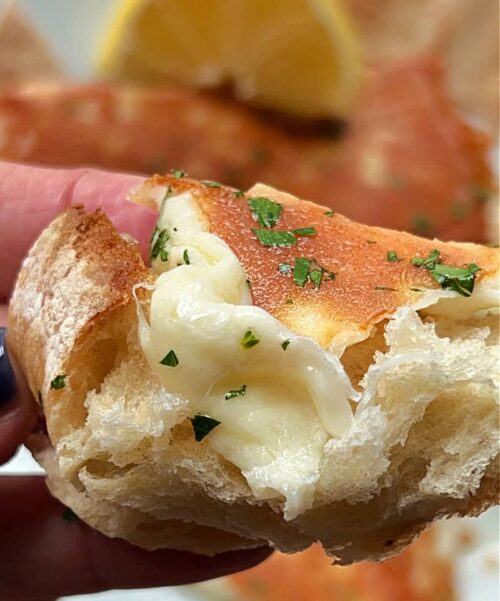 crusty bread topped with melted saganaki