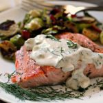 salmon with creamy dill sauce and side of brussels sprouts