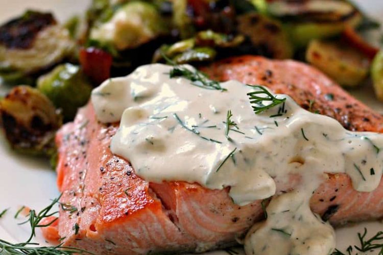 salmon with creamy dill sauce and side of brussels sprouts