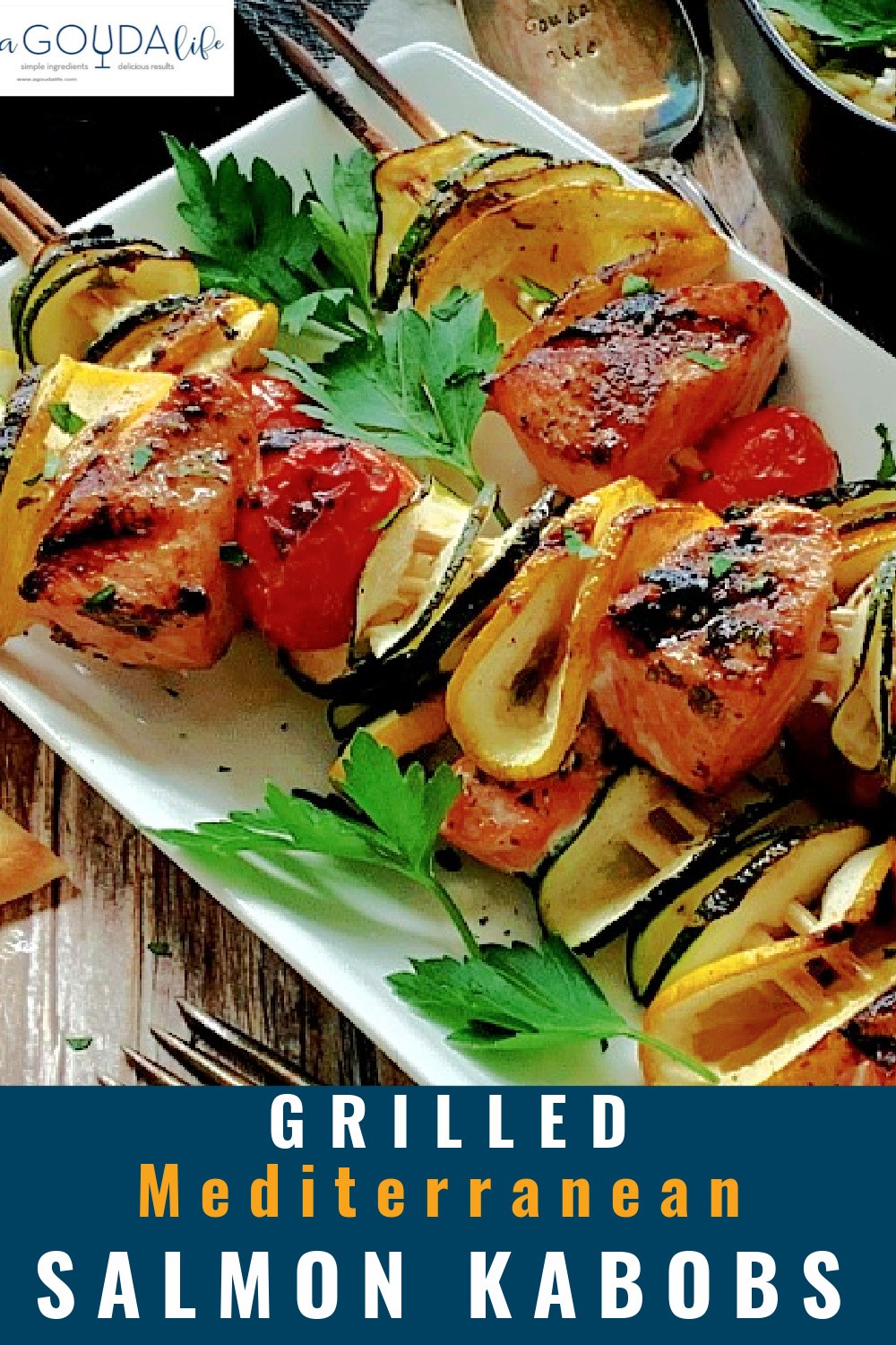 pinterest pin showing closeup of salmon and vegetable skewers