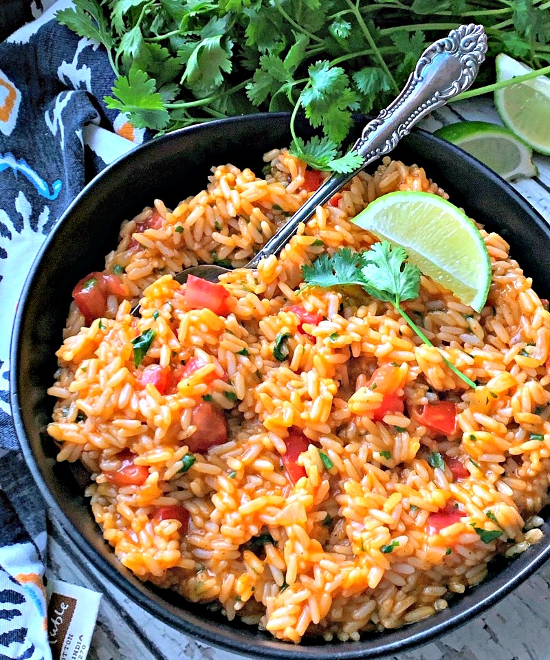 black bowl with easy mexican rice garnished with lime wedge