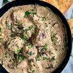 swedish meatballs and gravy in cast iron skillet