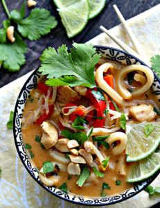 pad thai soup garnished with cilantro and lime