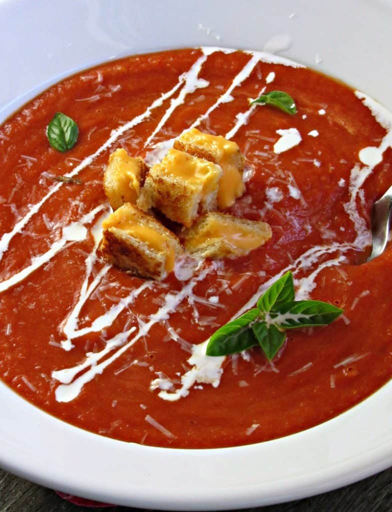Roasted Tomato Soup and Grilled Cheese Croutons. Caramelized oven roasted tomatoes, fresh herbs blended to an easy, creamy delicious comfort meal.