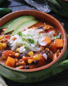 turkey sweet potato chili ~ overhead photo of chili garnished with avocado