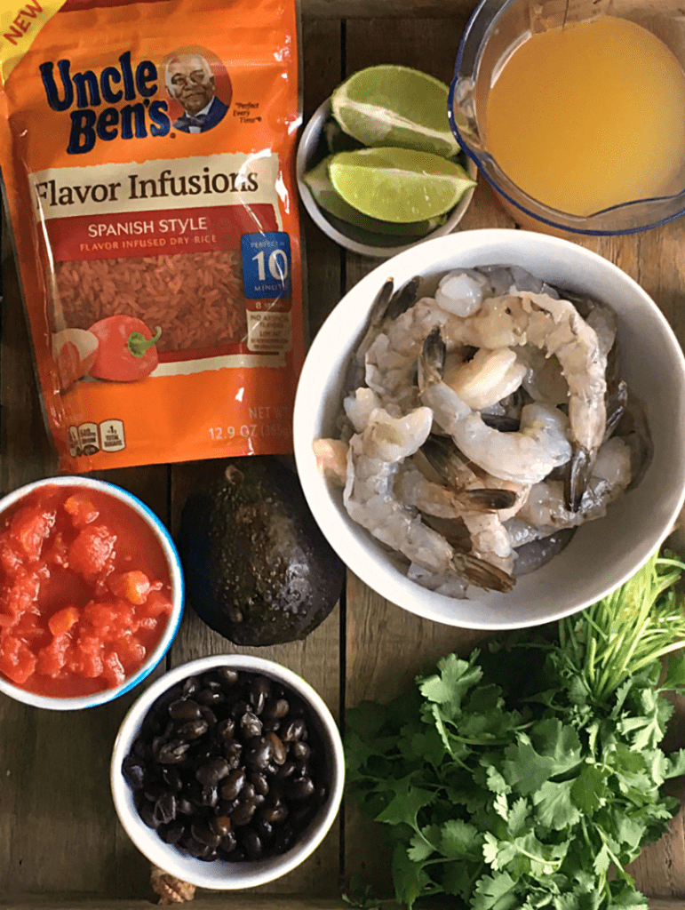 Spanish Shrimp and Rice: 1 pan + 20 minutes = shrimp, flavor infused rice in a rich, robust, tomatoey sauce with a hint of lime, black beans and avocado.
