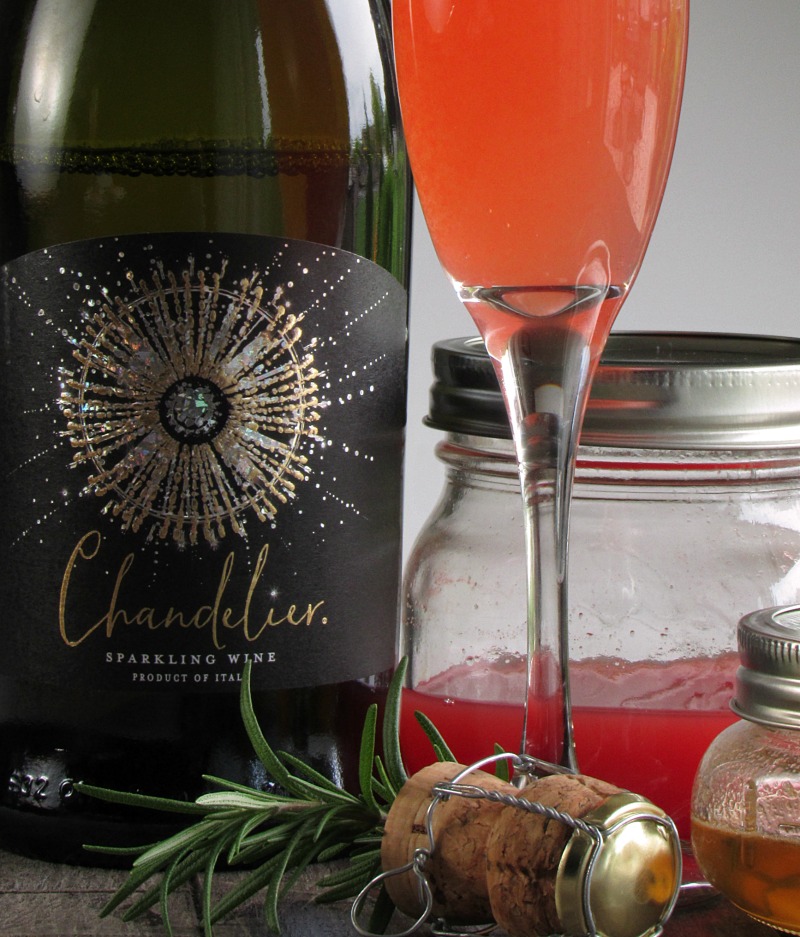 watermelon sparkling wine cocktail ~ chandelier sparkling wine with jar of watermelon juice and cocktail in champagne flute