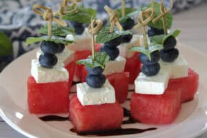 white plate with watermelon feta blueberry bites